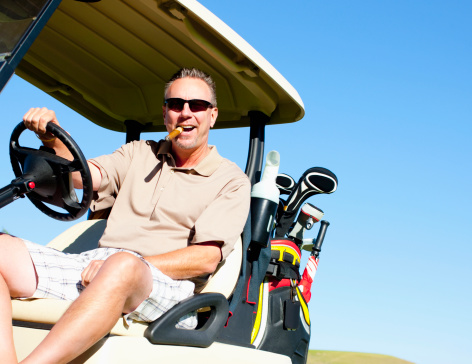 golf cart driving man cigar caucasian smoking while carts royalty res