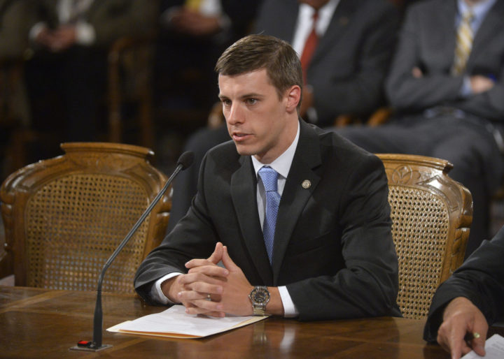 Image of Lee Chatfield in a suit testifying in front of a committee